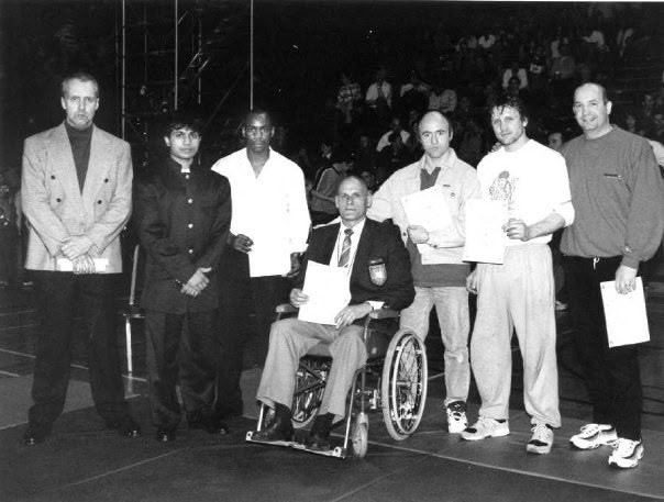 Dr. Eugene de Silva with martial artists after presenting fellowships at the Clash of the Titans, Birmingham, 1995